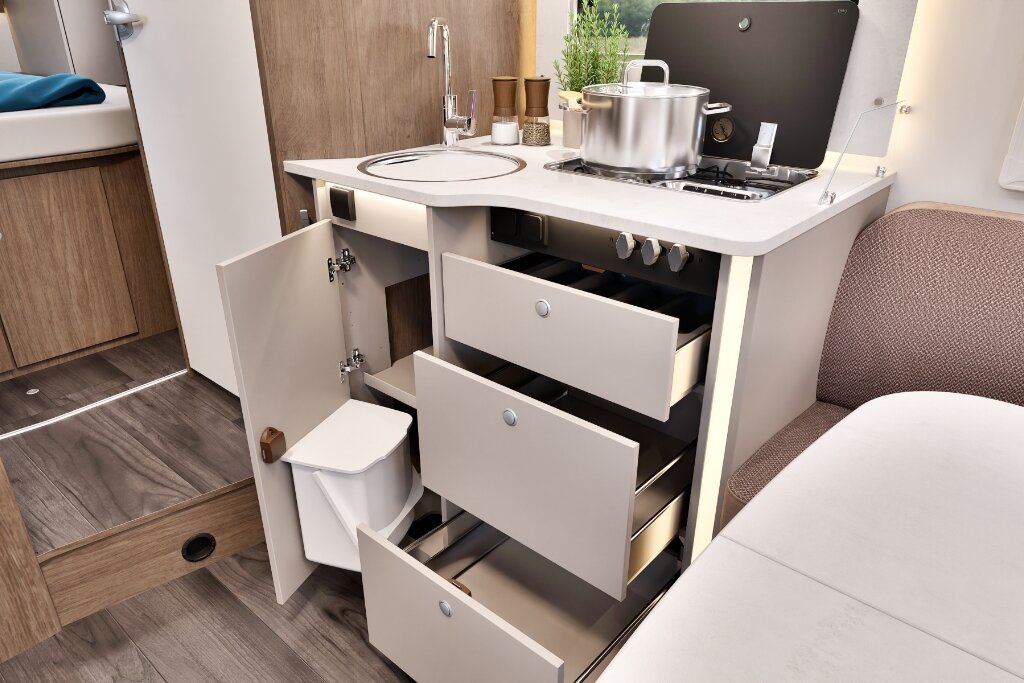 Carado motorhome kitchen with sink, gas hob, open drawers and waste bin