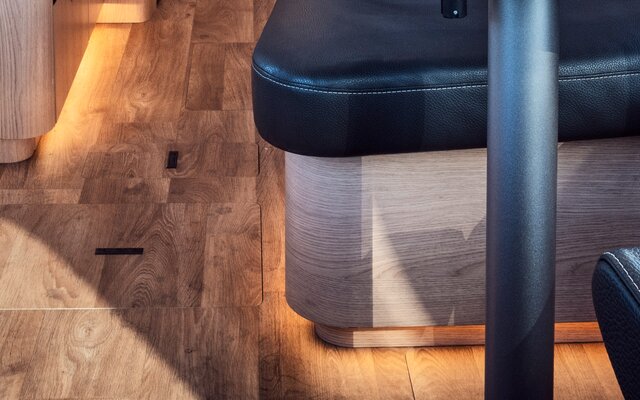 Multi-level ambient lighting including plinth lighting in the HYMER motorhome floor