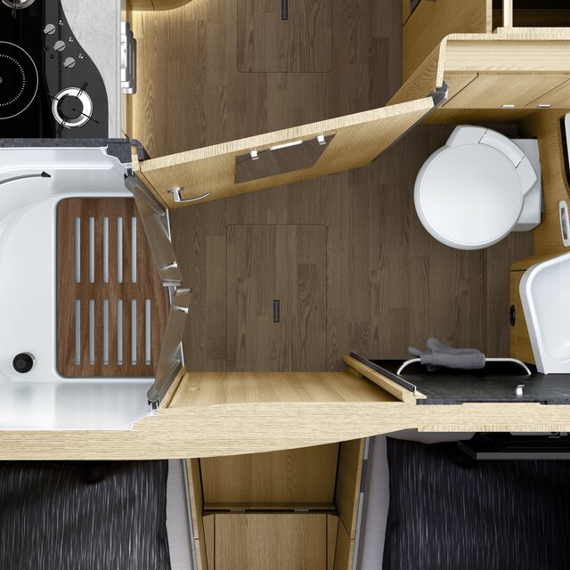 Bathroom in the HYMER B-Class MasterLine I with white toilet, wash basin and separate shower with wooden slatted frame