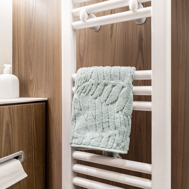 Towel radiator with a stored towel in the bathroom of the HYMER B MasterLine