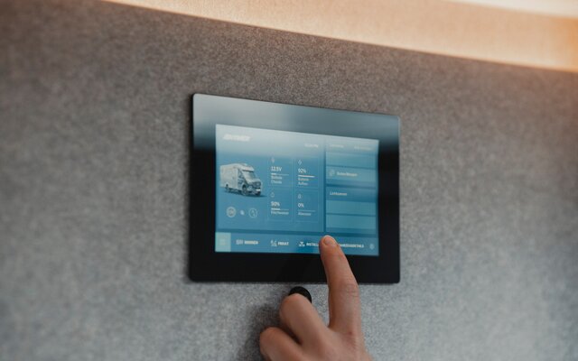 Control panel of the HYMER Smart Connect Unit built into the wall of a motorhome